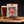 Wild West Original Beef Jerky-pose ved siden av et glass øl og løse biffstrimler på et trebord